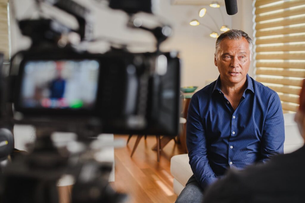 Behind the scenes photo of corporate video production with Stan Grant. 